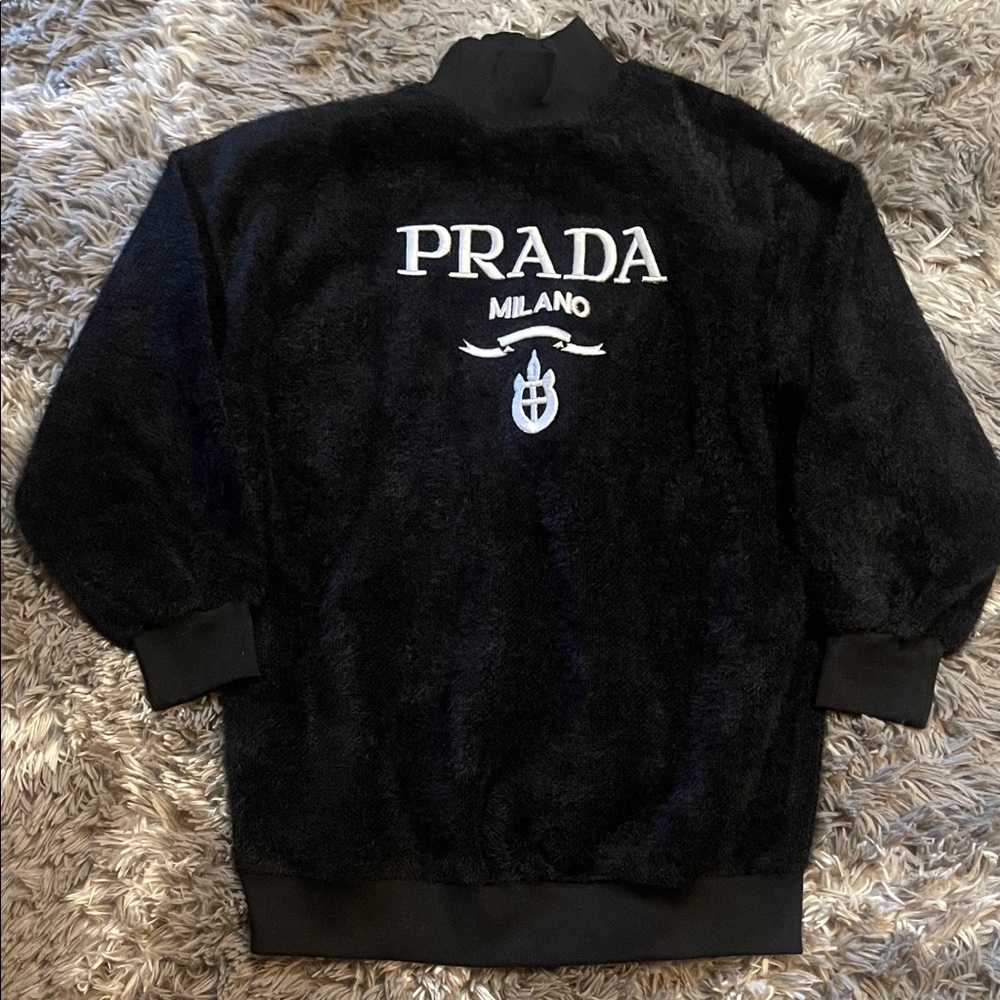 Black sweater logo